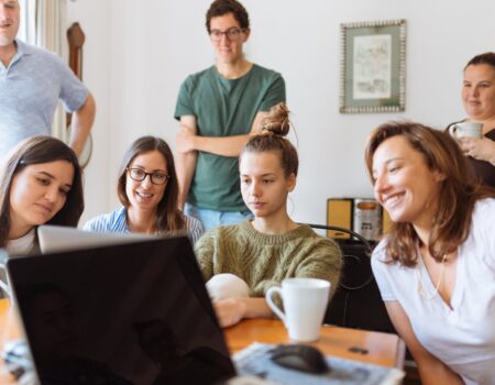 people looking at laptop computer