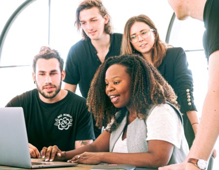 woman sharing her presentation with her colleagues